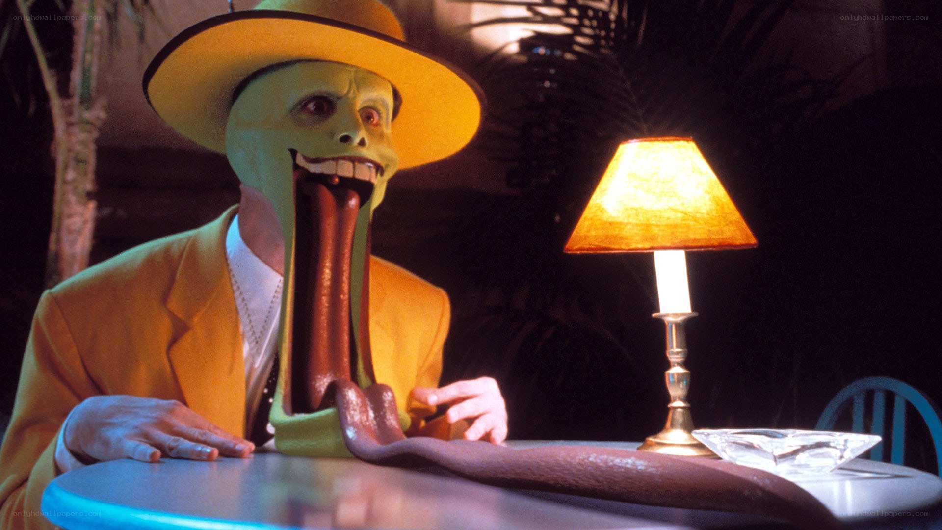 The Mask character at a table