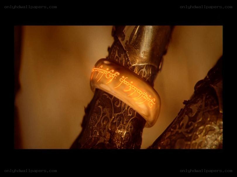 The One Ring glowing on a hand