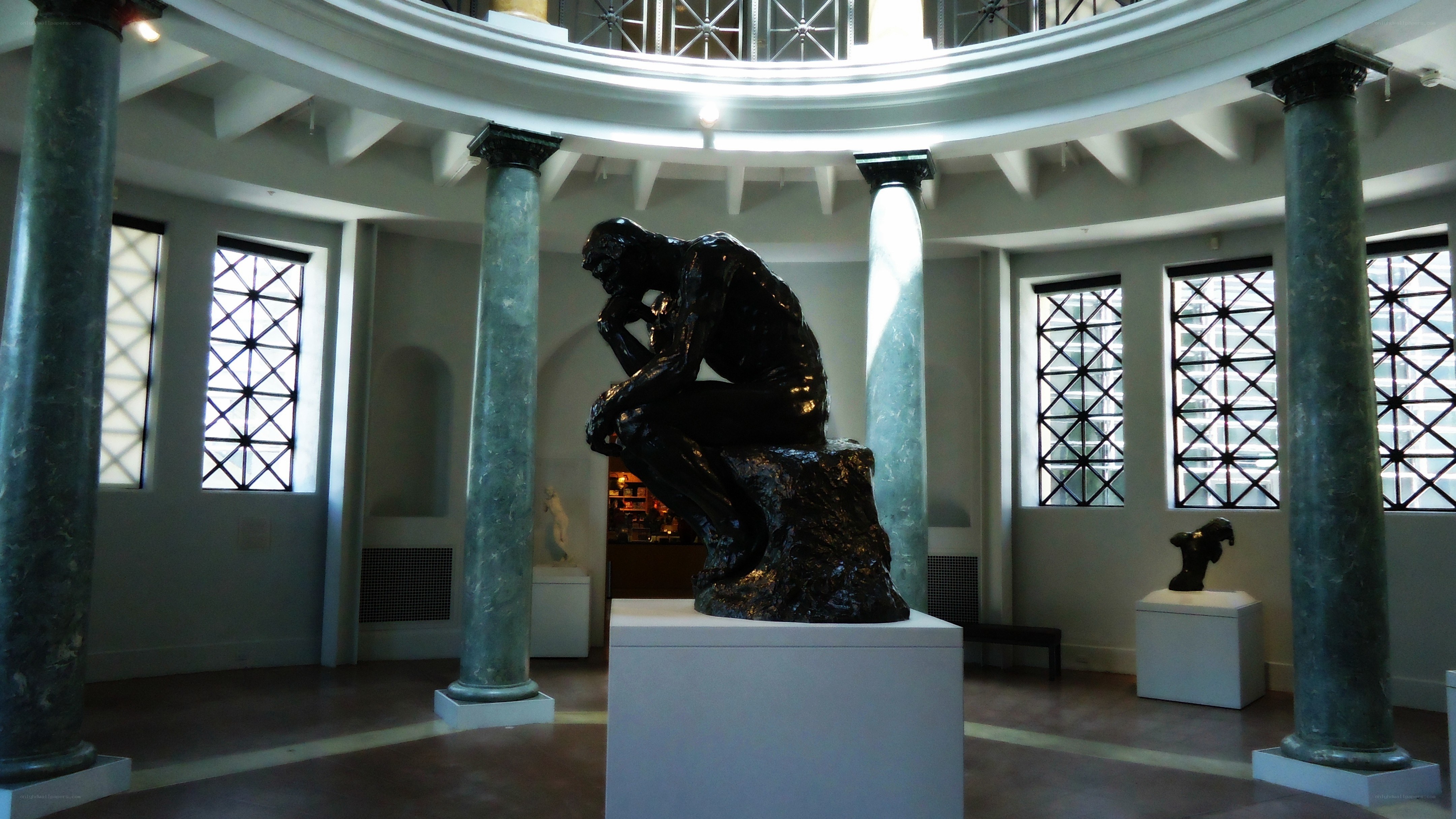 The Thinker sculpture in a gallery