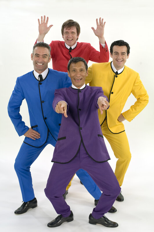 The Wiggles in colorful suits
