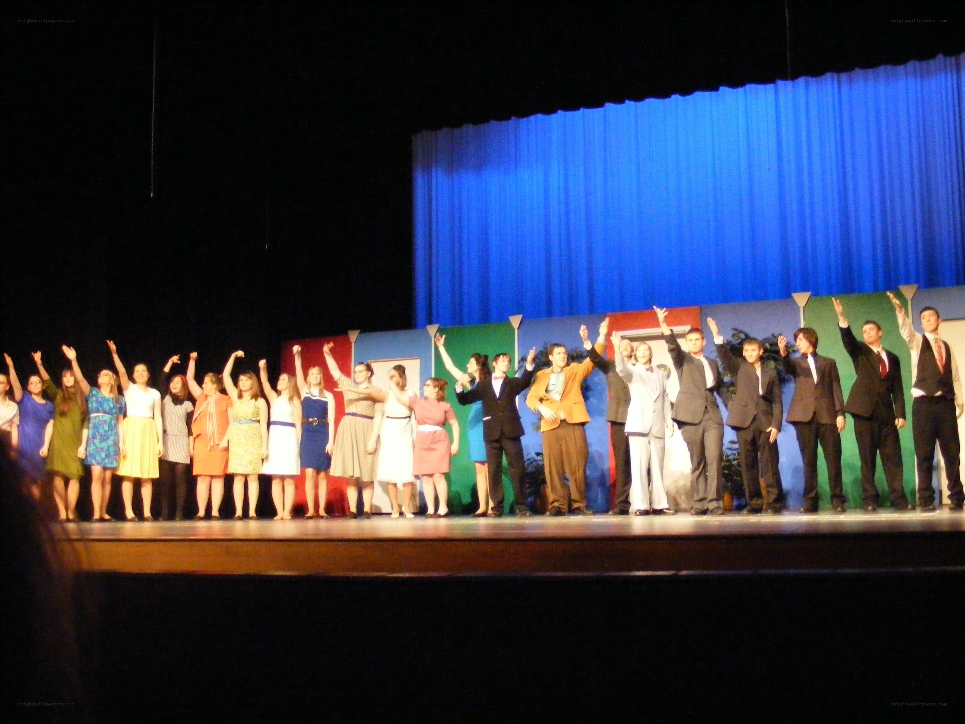 Theatrical cast on stage
