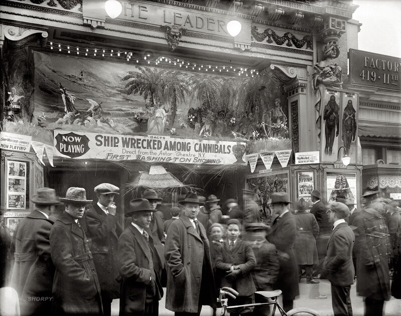 Theatrical crowd outside a movie theater