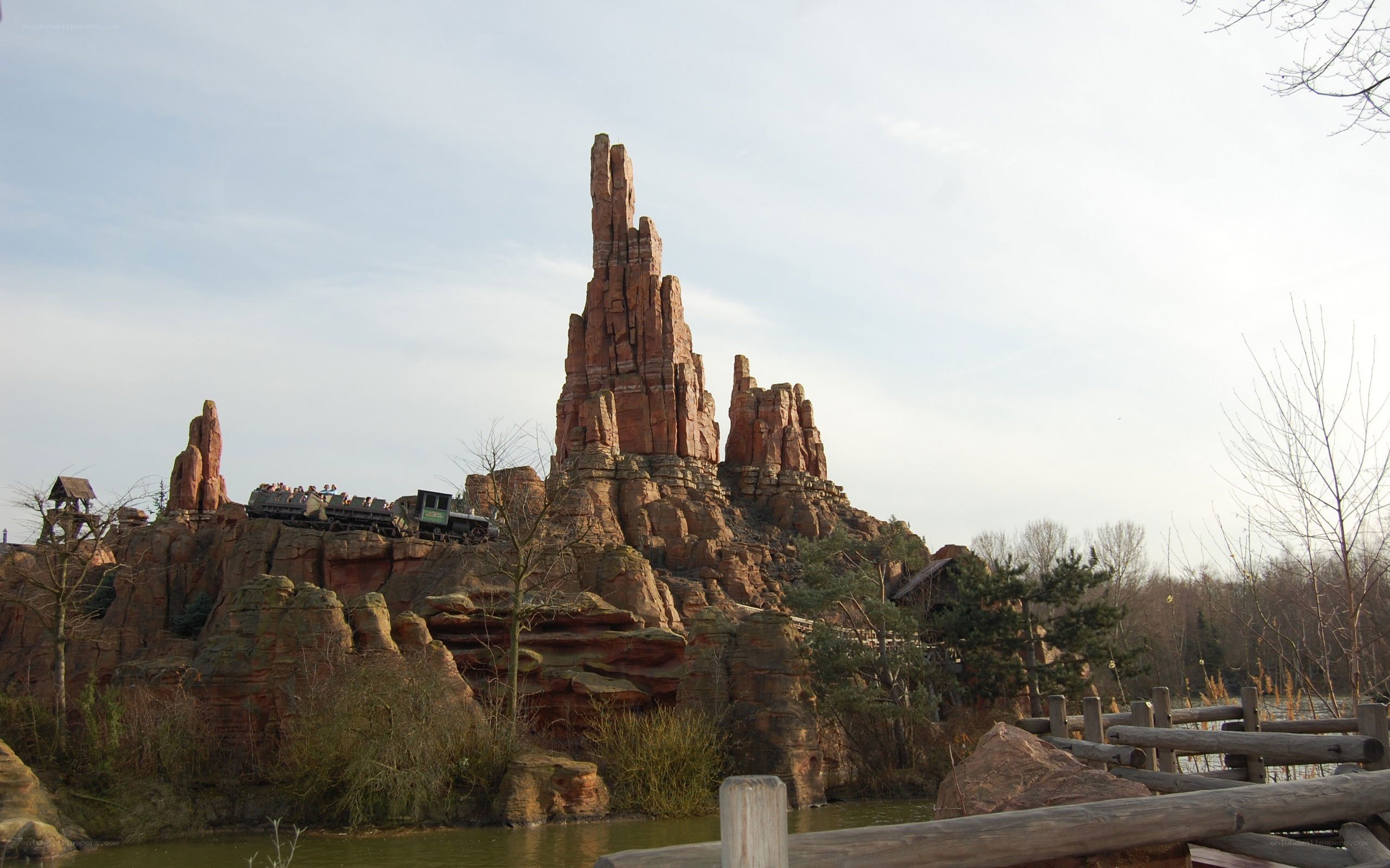 theme park ride with rock formation