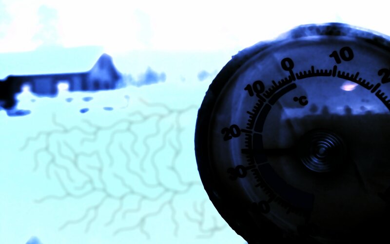 Thermometer in snowy landscape