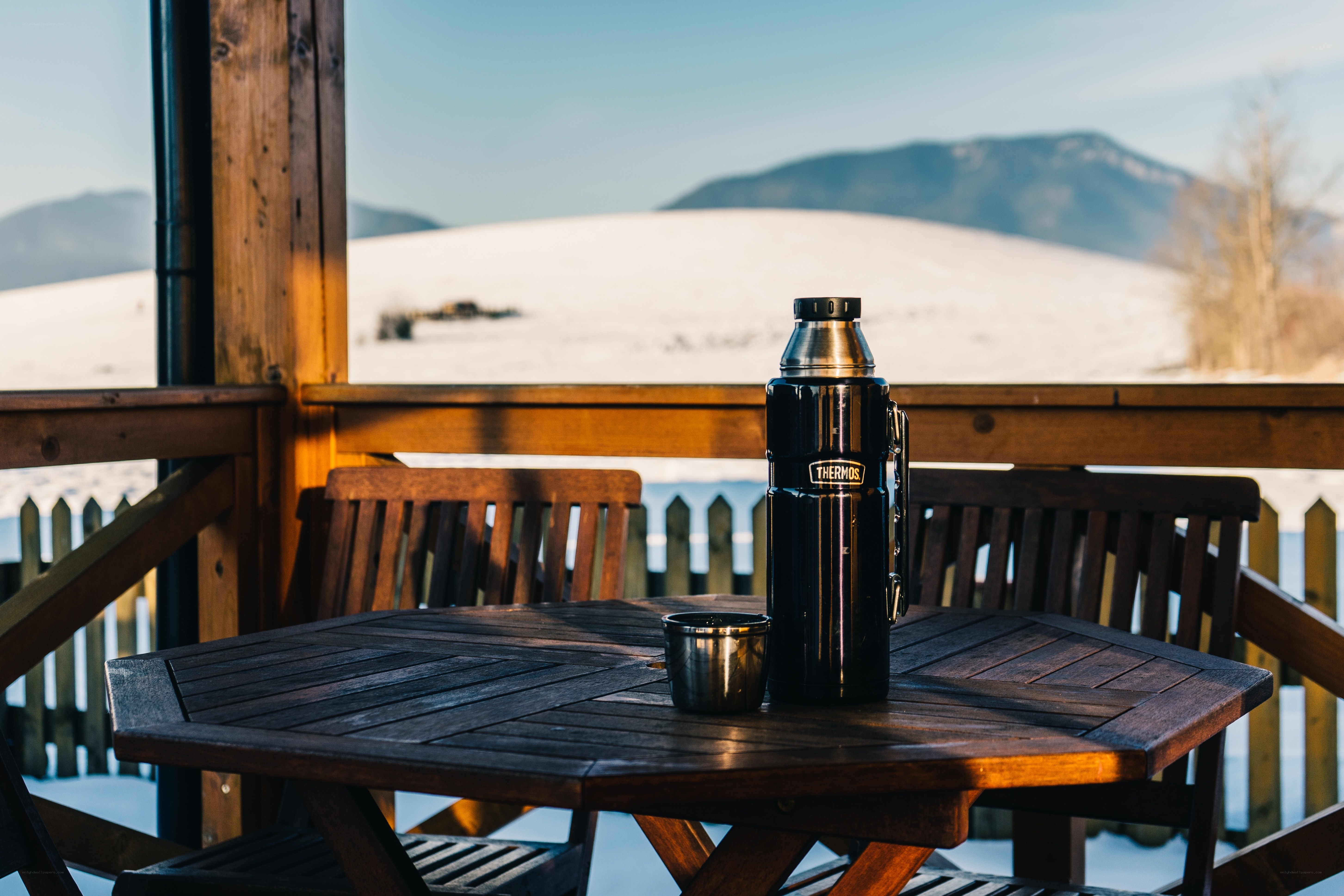 Thermos on a snowy deck