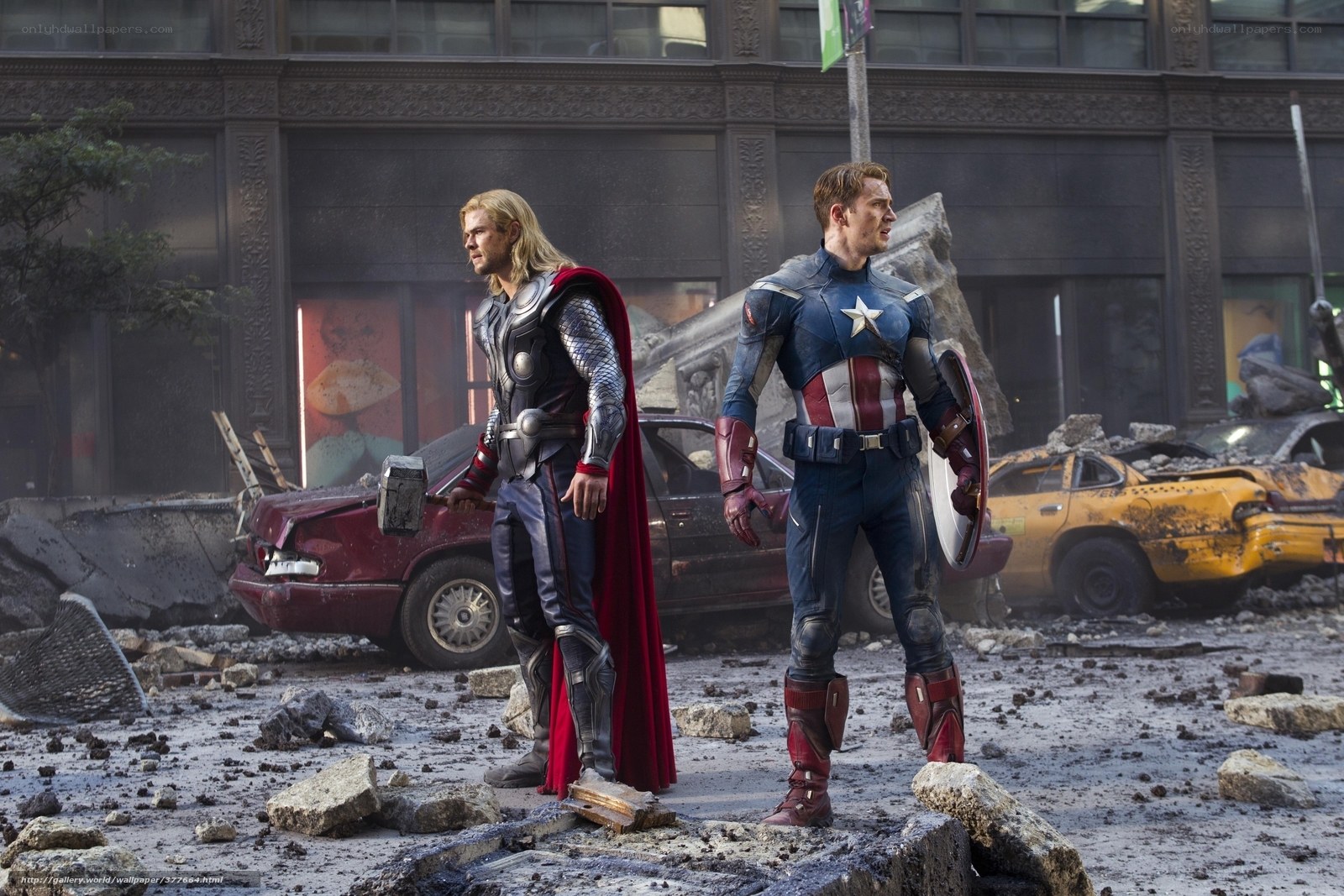 Thor and Captain America stand amidst rubble