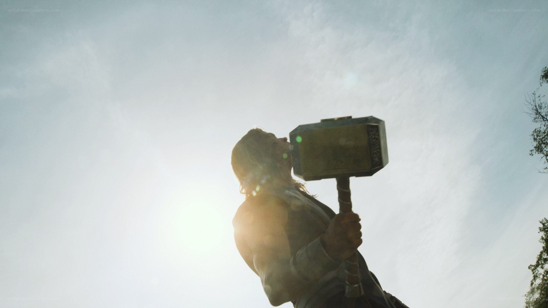 Thor holding Mjolnir in sunlight