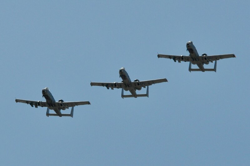 Three A-10 Thunderbolt II aircraft in formation