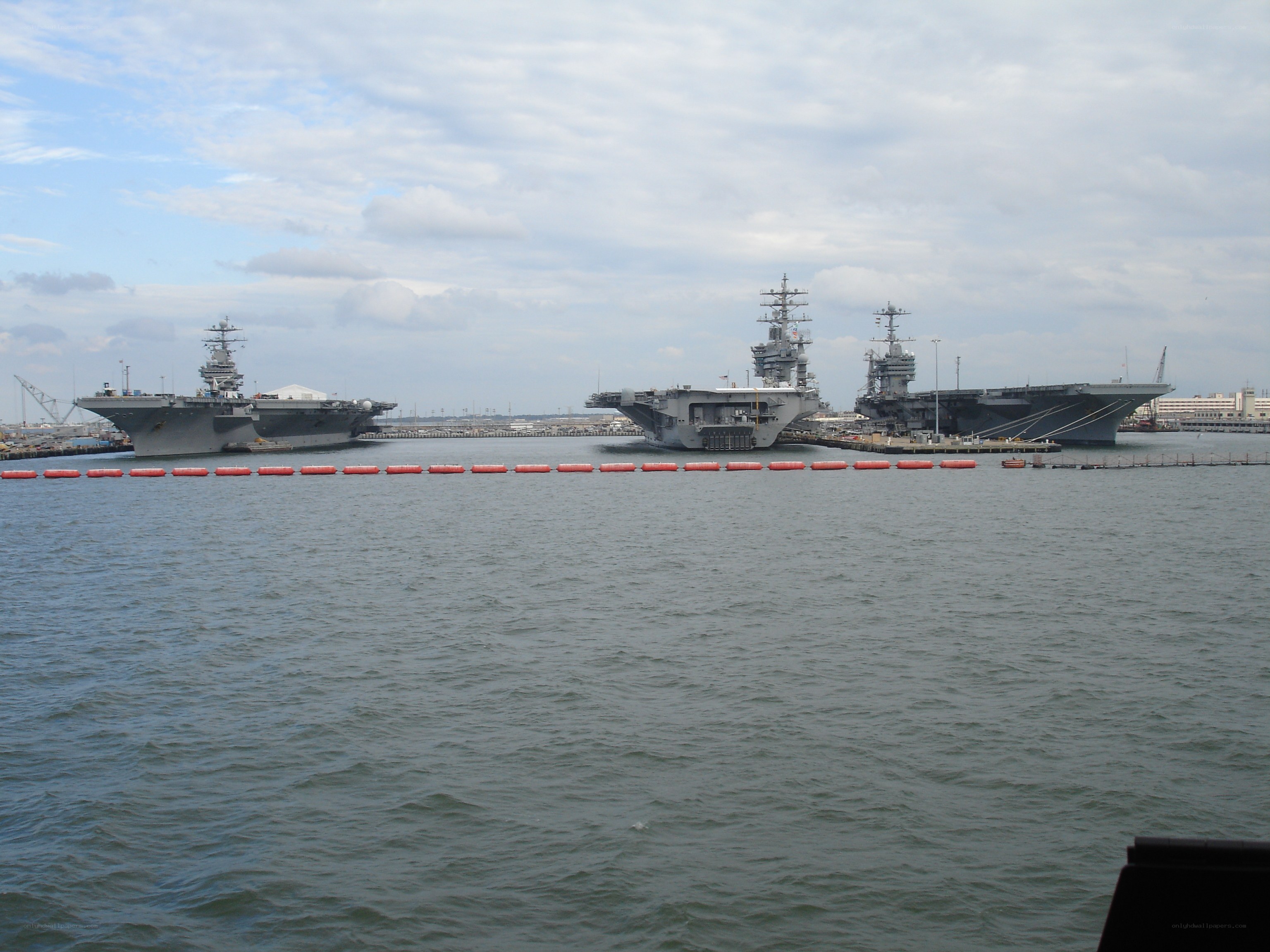 Three aircraft carriers in port