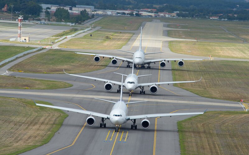 Three Airplanes on Runway