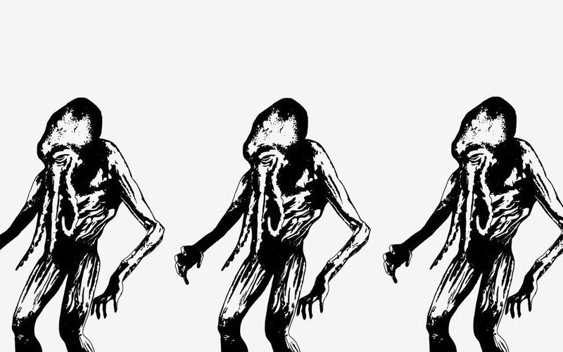 three alien figures in black and white