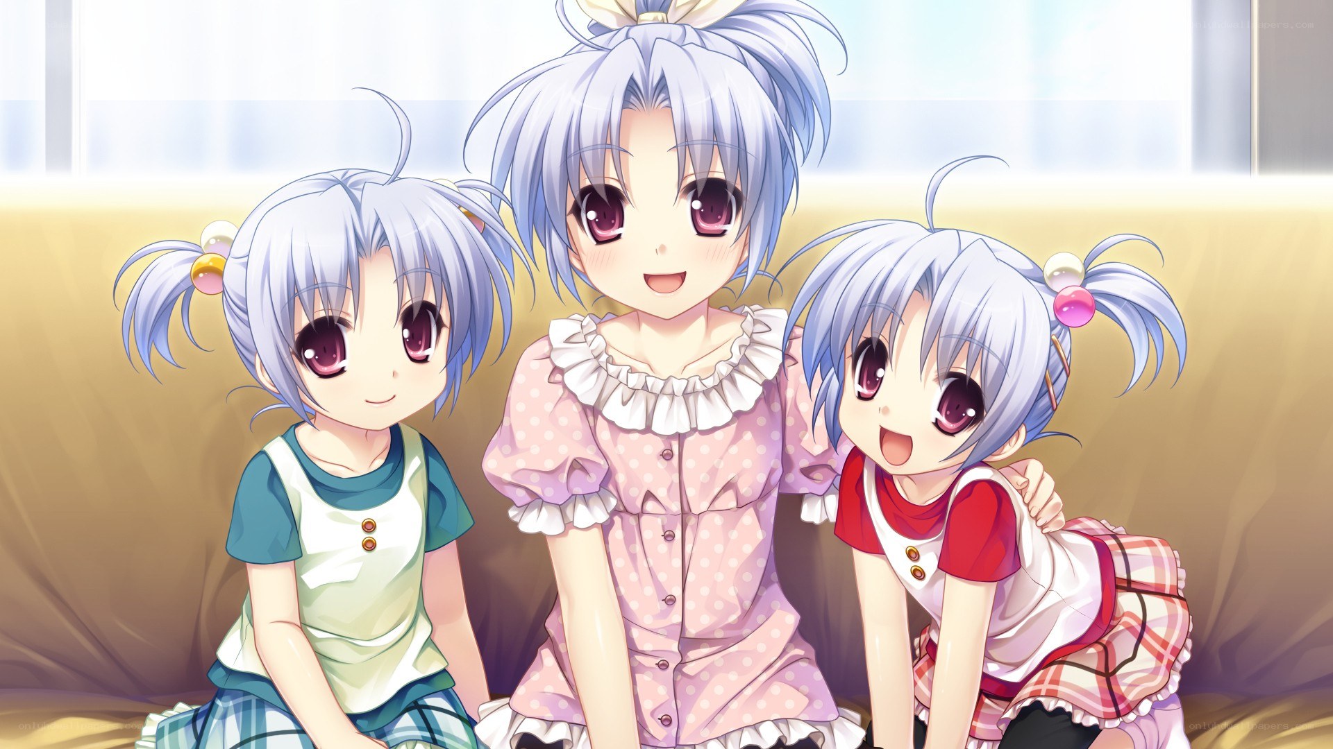 Three anime girls on a couch