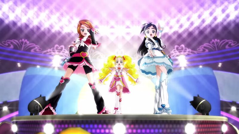 Three Anime Girls on Stage — Purple, Energetic, Lights