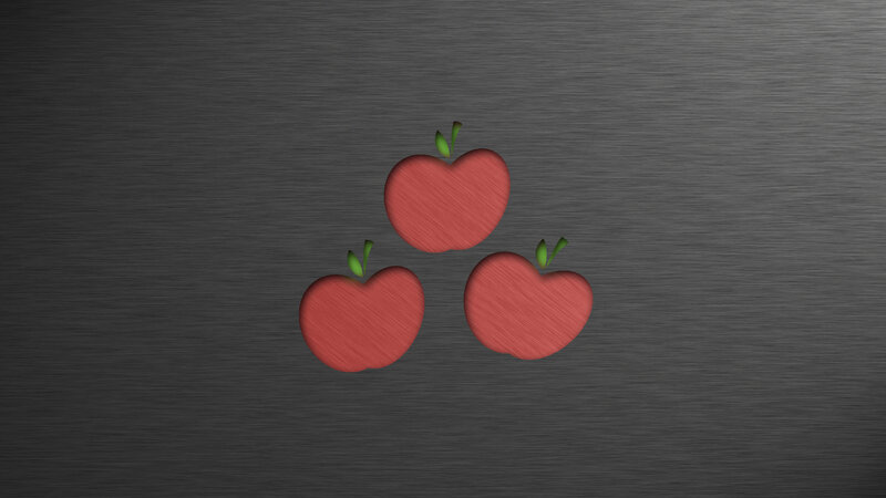 Three apples on metal