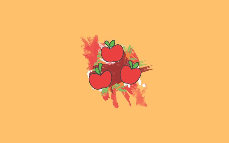 three apples on orange