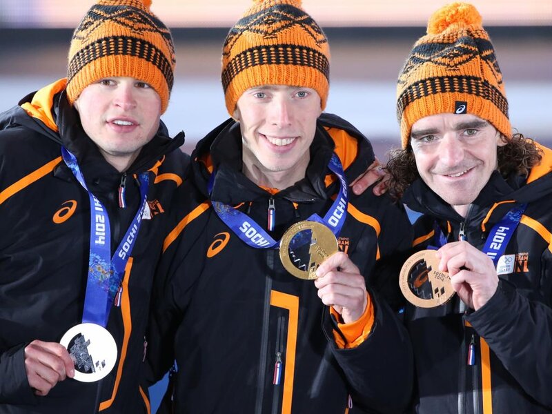 Three Athletes on Podium — Black, Celebratory, Winter, Photograph