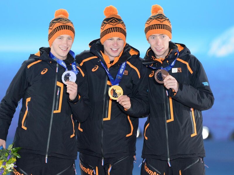 Three Athletes on Podium — Black