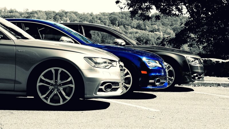 Three Audi cars parked in a row