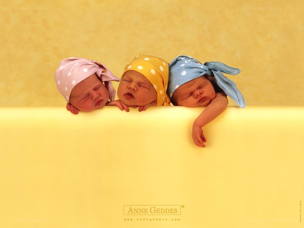 three babies in bonnets