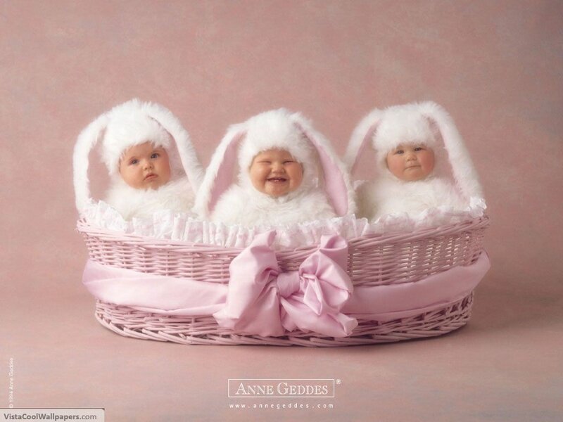three babies in bunny hats