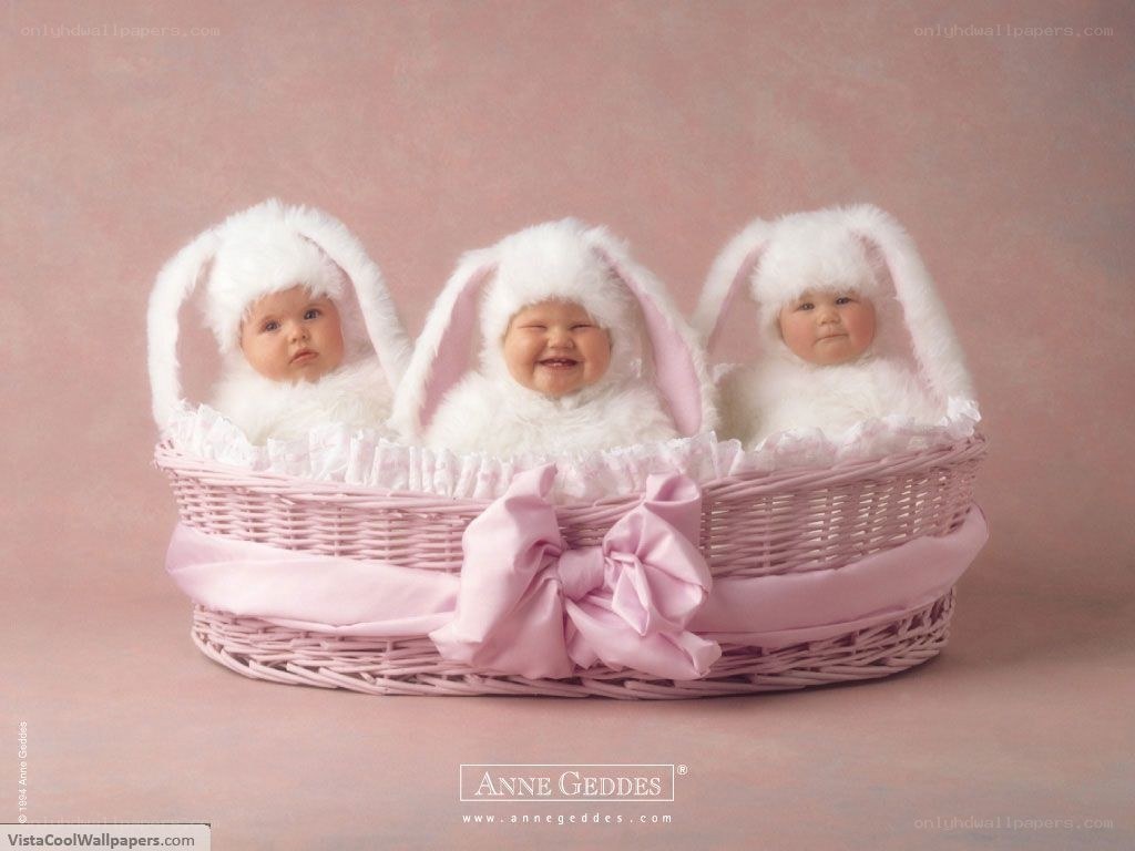 three babies in bunny hats
