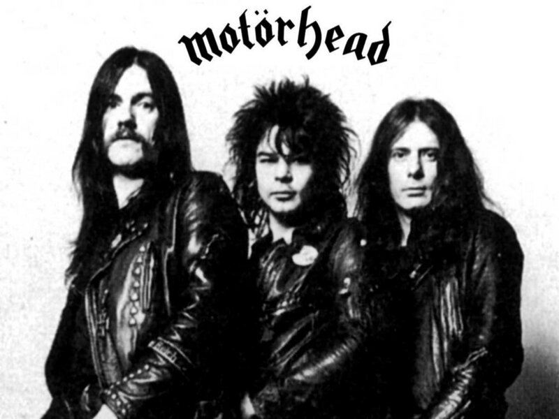 Three Band Members — Black, Serious