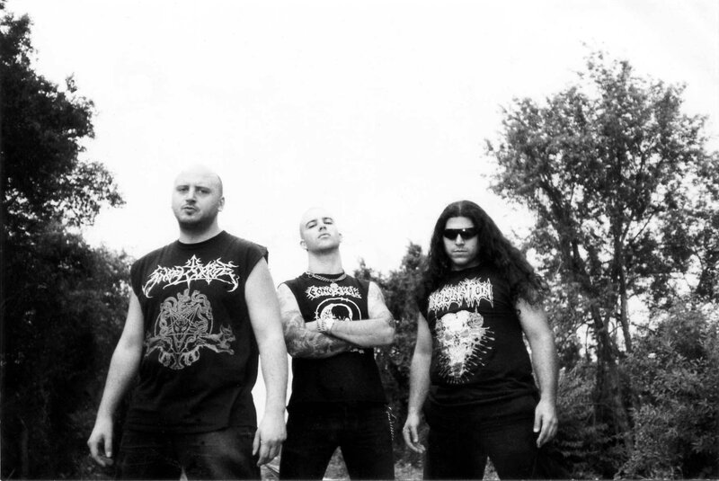 three band members in black shirts