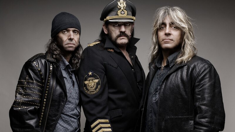 Three band members in leather jackets