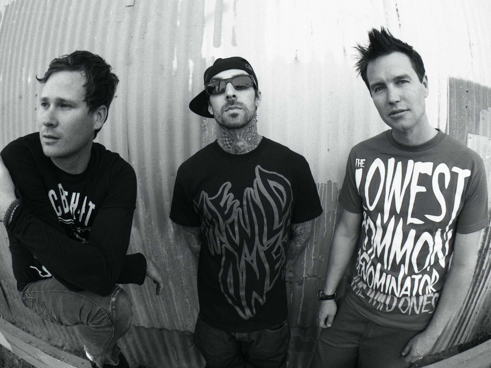 three band members posing