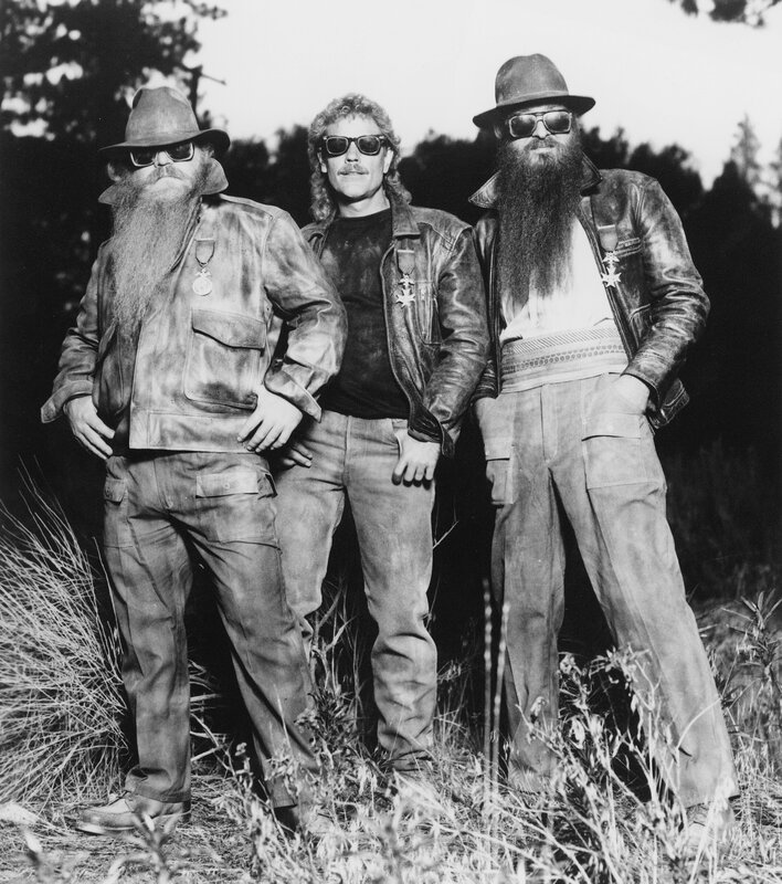 Three bearded men in leather jackets