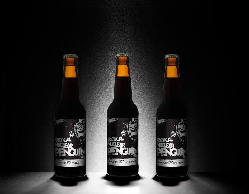 three beer bottles in spotlight