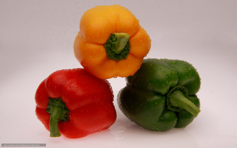 Three bell peppers on white
