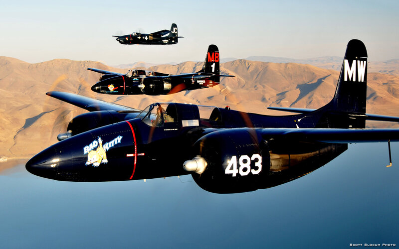 Three Black Aircraft in Flight