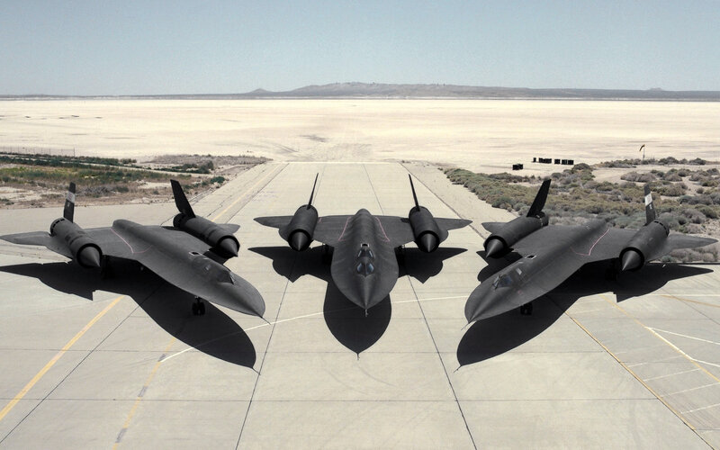 Three Black Jets on Runway