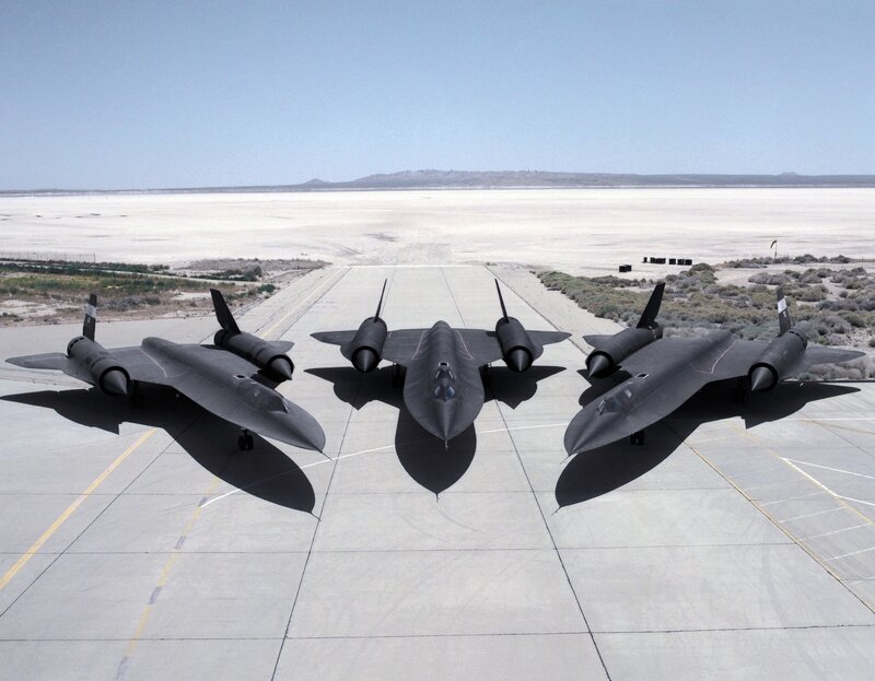 Three Black Jets on Tarmac — Gray, Dramatic