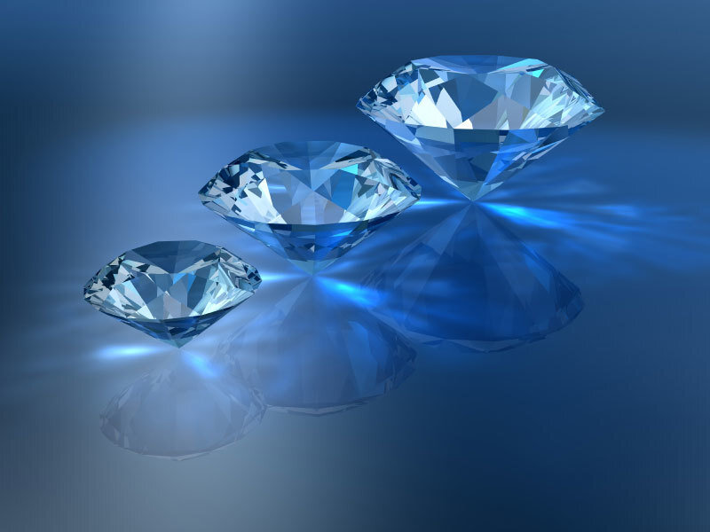 Three blue diamonds on reflective surface