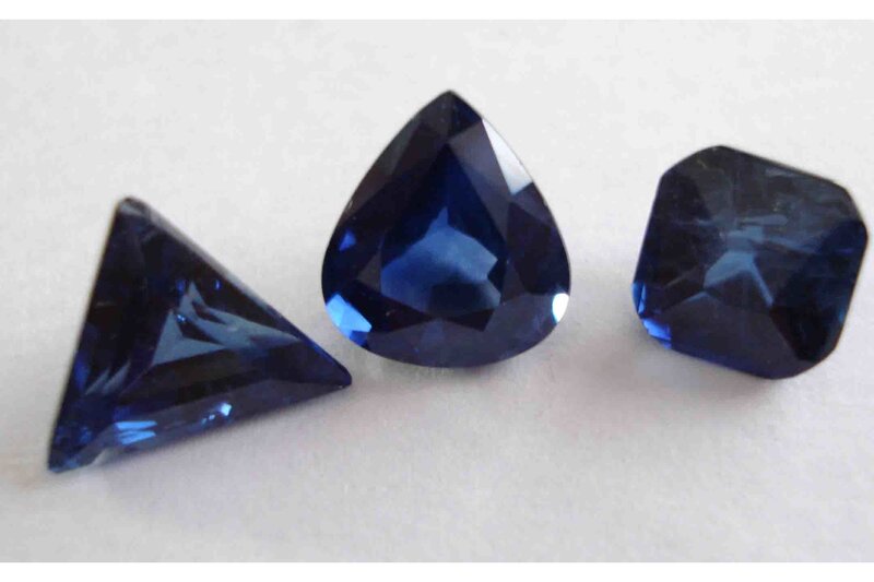 three blue gemstones