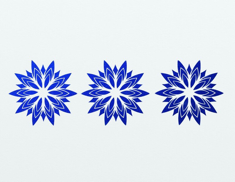 three blue snowflake designs