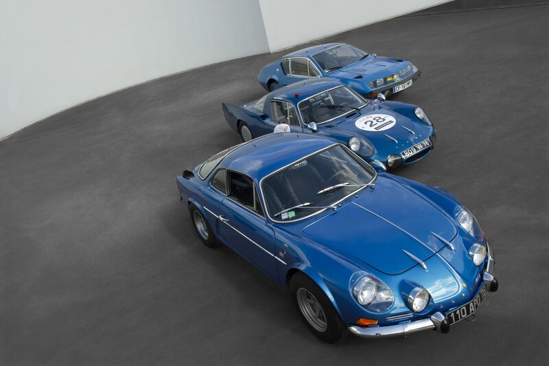 Three Blue Sports Cars