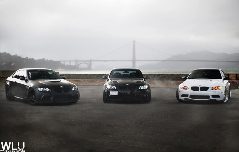 Three BMW cars at a bridge