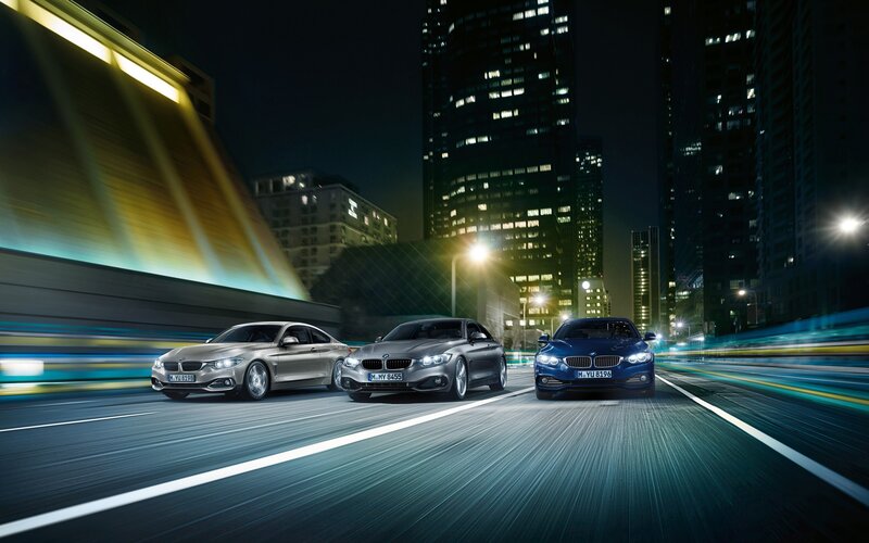Three BMW Cars on Road — Blue