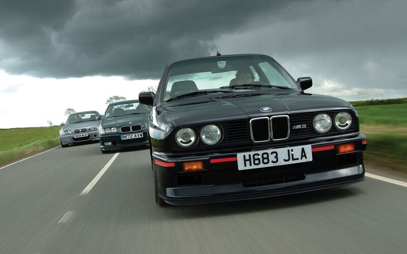three bmw m3 cars on road