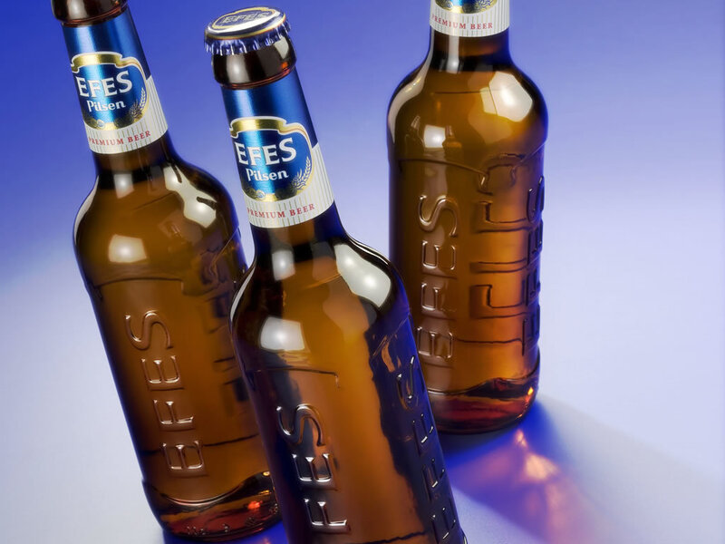 Three bottles of Efes Pilsen beer