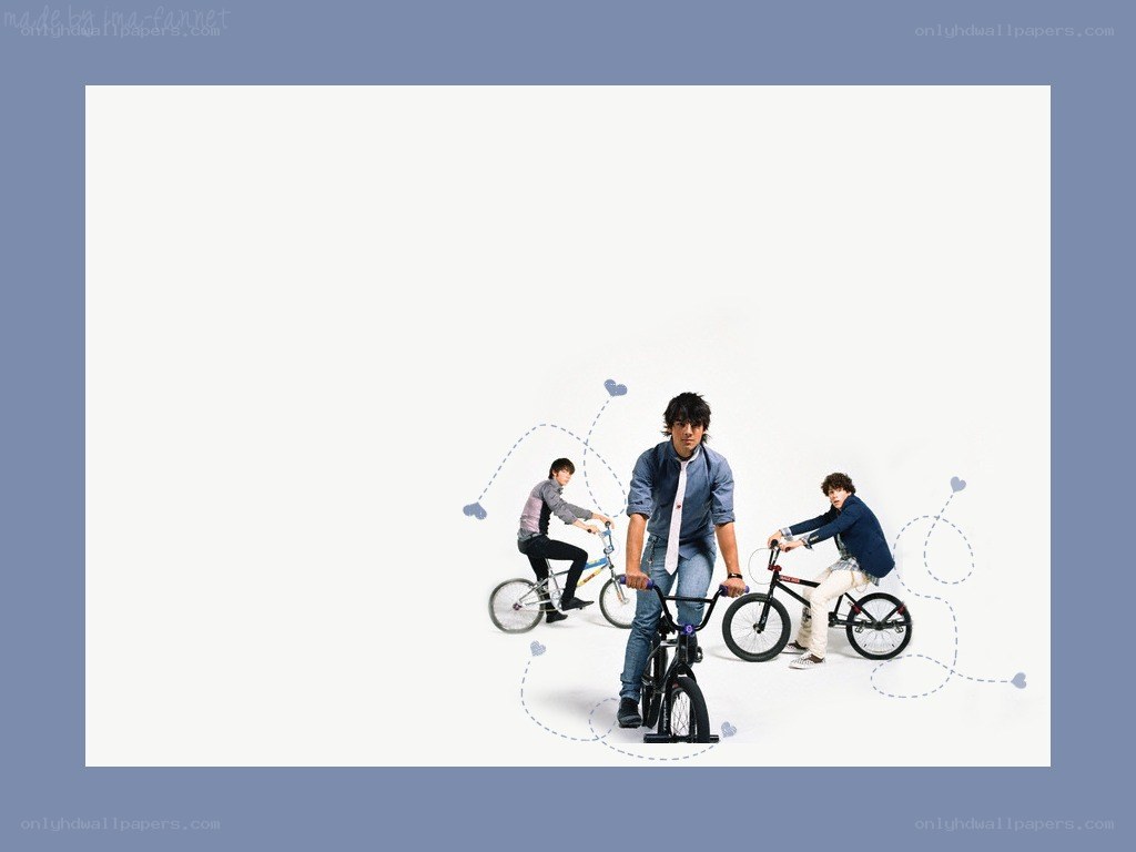 Three boys on bicycles