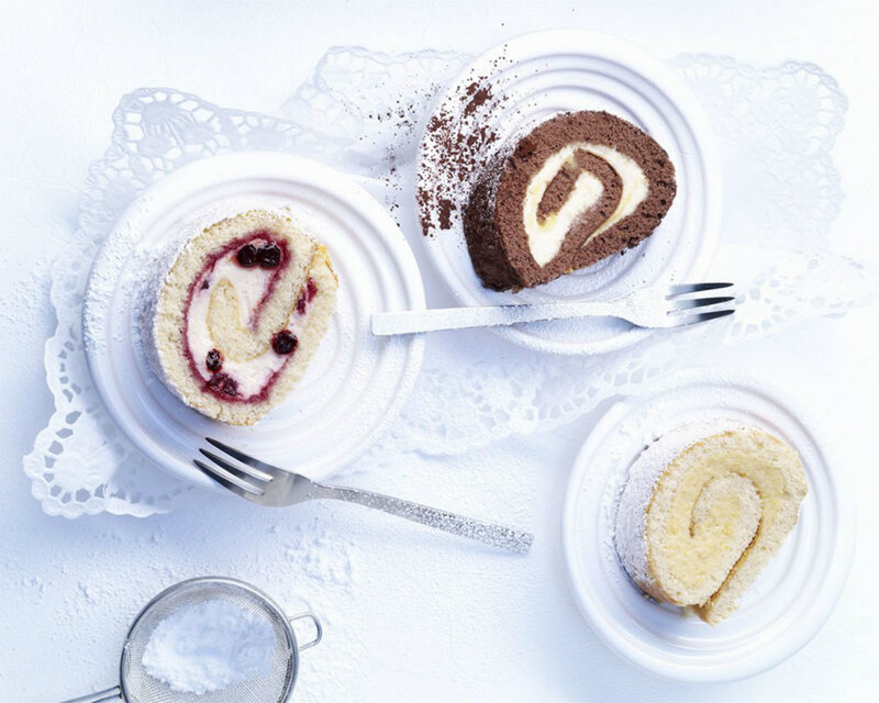 Three Cake Rolls on Plates