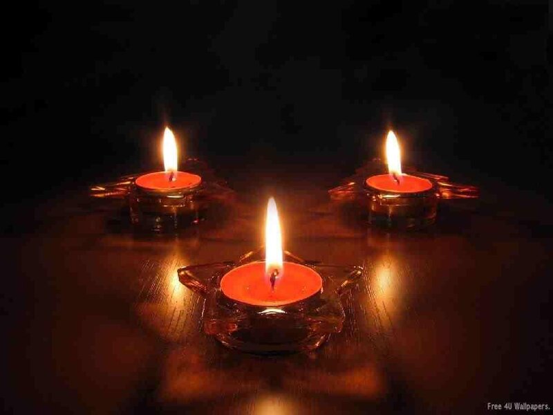 Three candles in glass holders