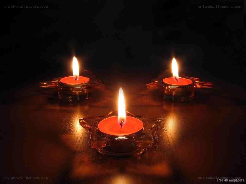 Three candles in glass holders