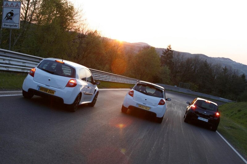 Three cars on a winding road