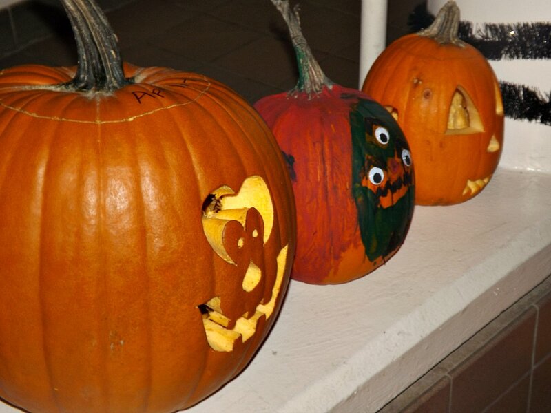Three Carved Pumpkins — Orange, Festive, Night