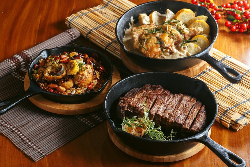 Three Cast-iron Skillets with Food